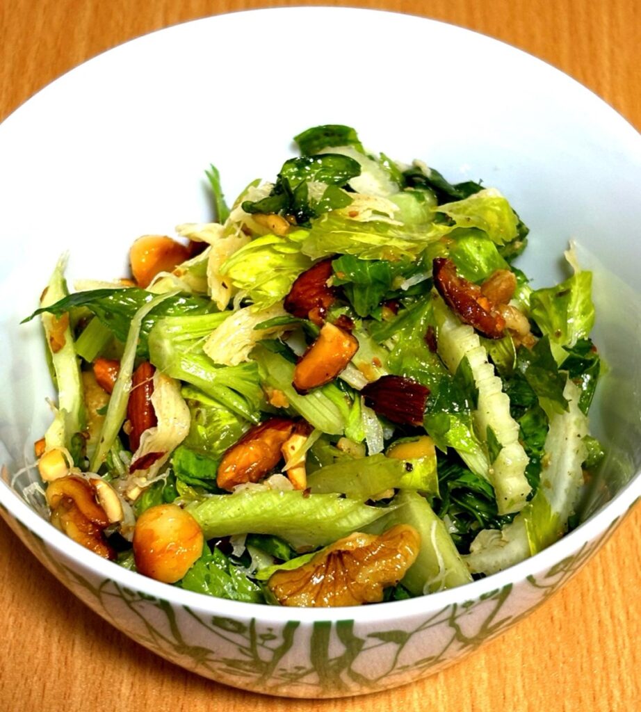 Celery and shredded squid salad with nuts. A colorful dish with crisp celery and aromatic nuts.