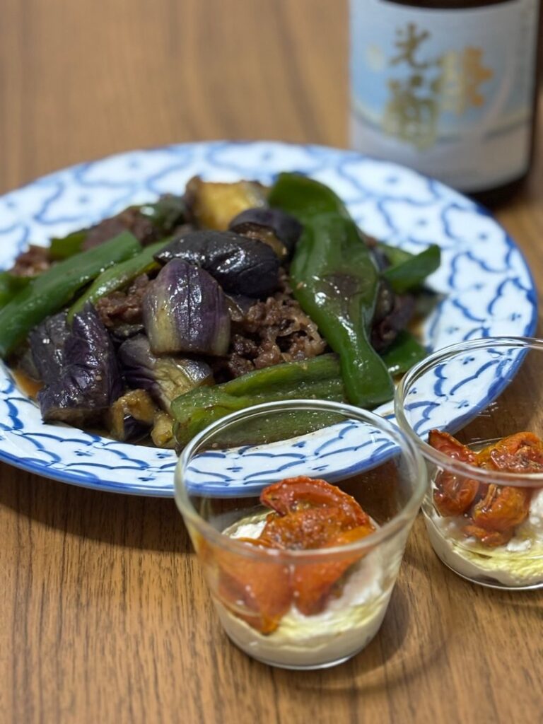 Stir-fried eggplant, bell pepper, and beef with miso; marinated dried tomatoes and cheese