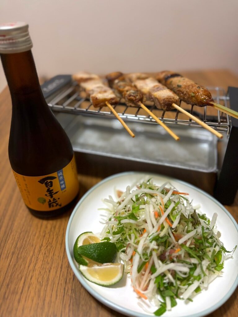Junmai Ginjo “Hyakunengura F44” paired with yakitori, served with a salad of shiso leaves and myoga ginger instead of cabbage.