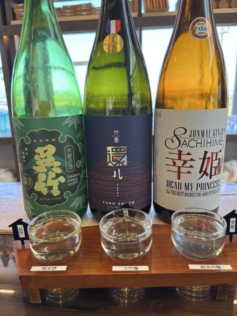 Three-sake tasting set at HAMA BAR featuring “Kuretake,” “Takenosono,” and “Sachihime.”