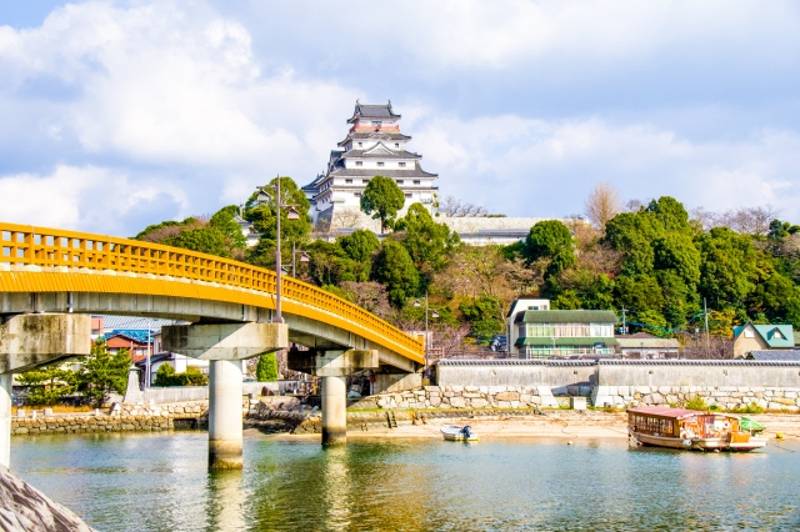 View of Karatsu Castle across a bridge with the sea in the foreground