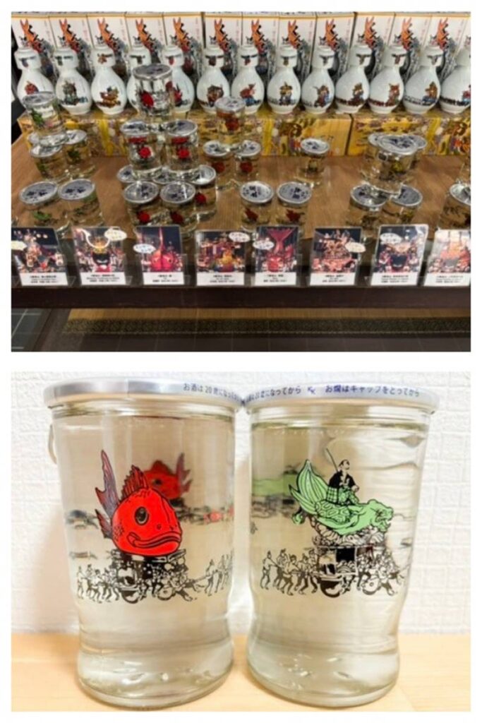 Juraku Taiko cup sake featuring Hikiyama designs displayed in a shop