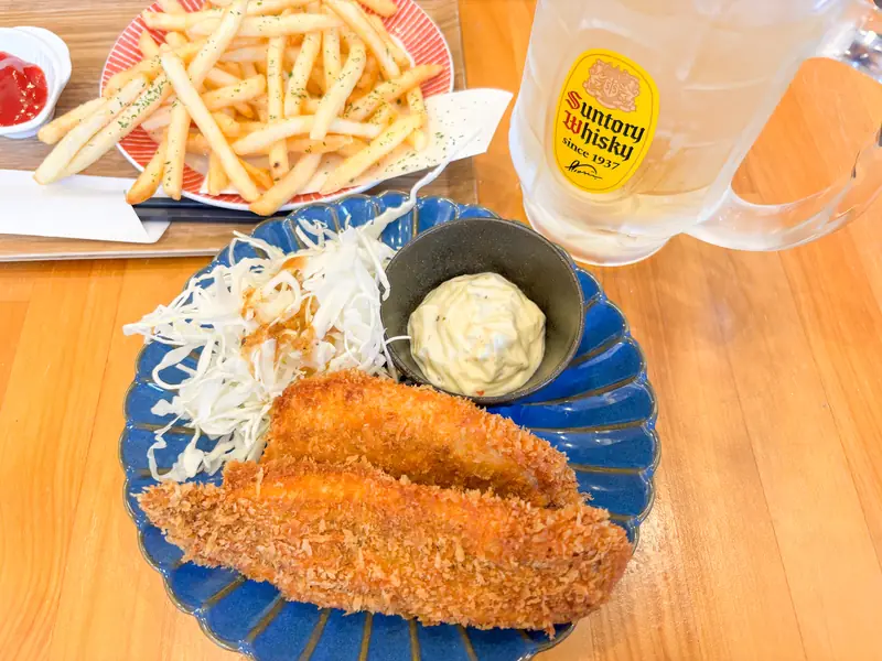 The exterior or dishes of Ryoshimeshi Raishin, a fisherman's meal restaurant in Fukuoka.