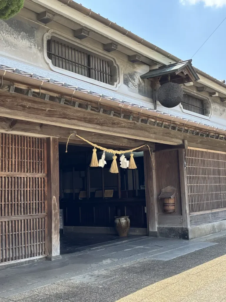 The exterior of the former Toyomura Sake Brewery facility in Fukutsu, Fukuoka — a historic sake brewery founded in the Meiji era, now designated as a National Important Cultural Property.