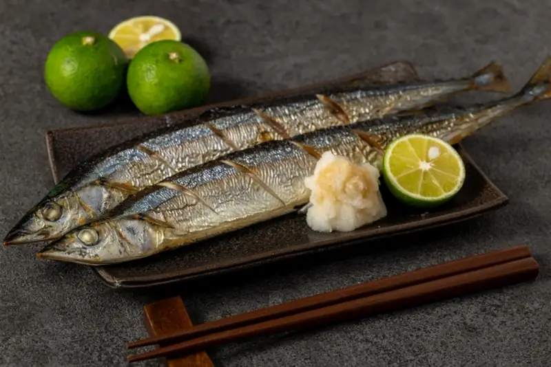Grilled fish served with green sour citrus and grated daikon